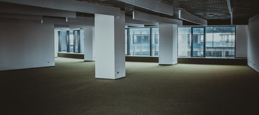 An empty open-plan office floor, ready to fit out